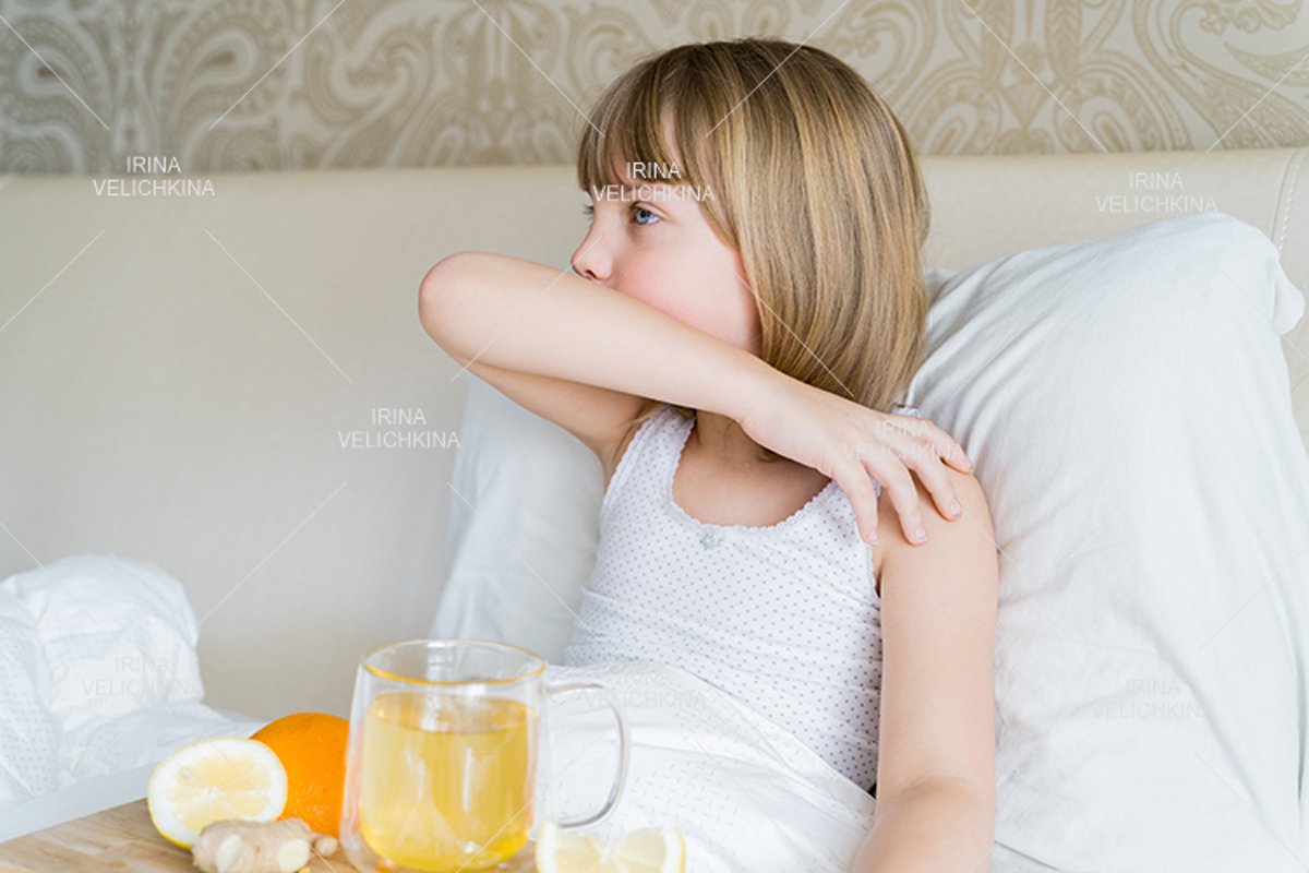 Sick girl in bed. Cup of flu drugs. Tea, orange,lemon,ginger example image 1