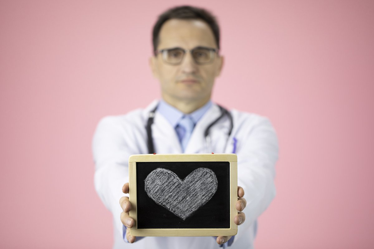 Doctor therapist with a stethoscope on a pink background example image 1