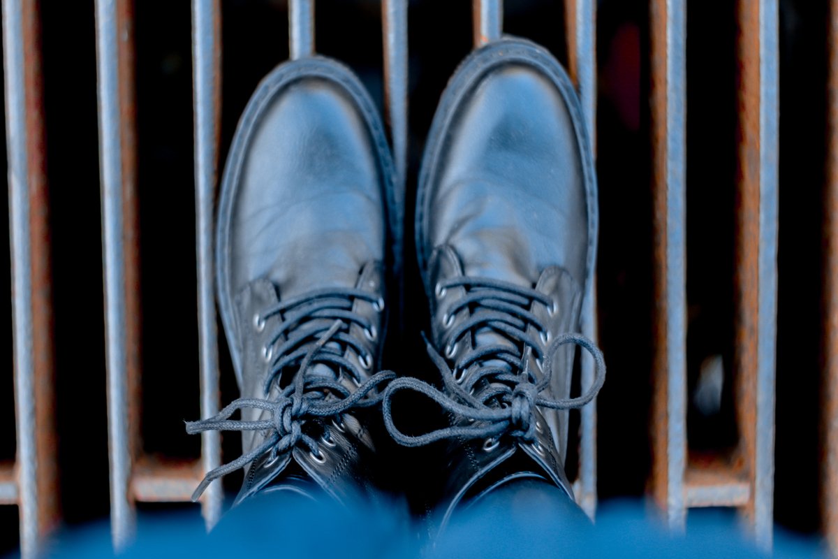 top view on black leather shoes example image 1