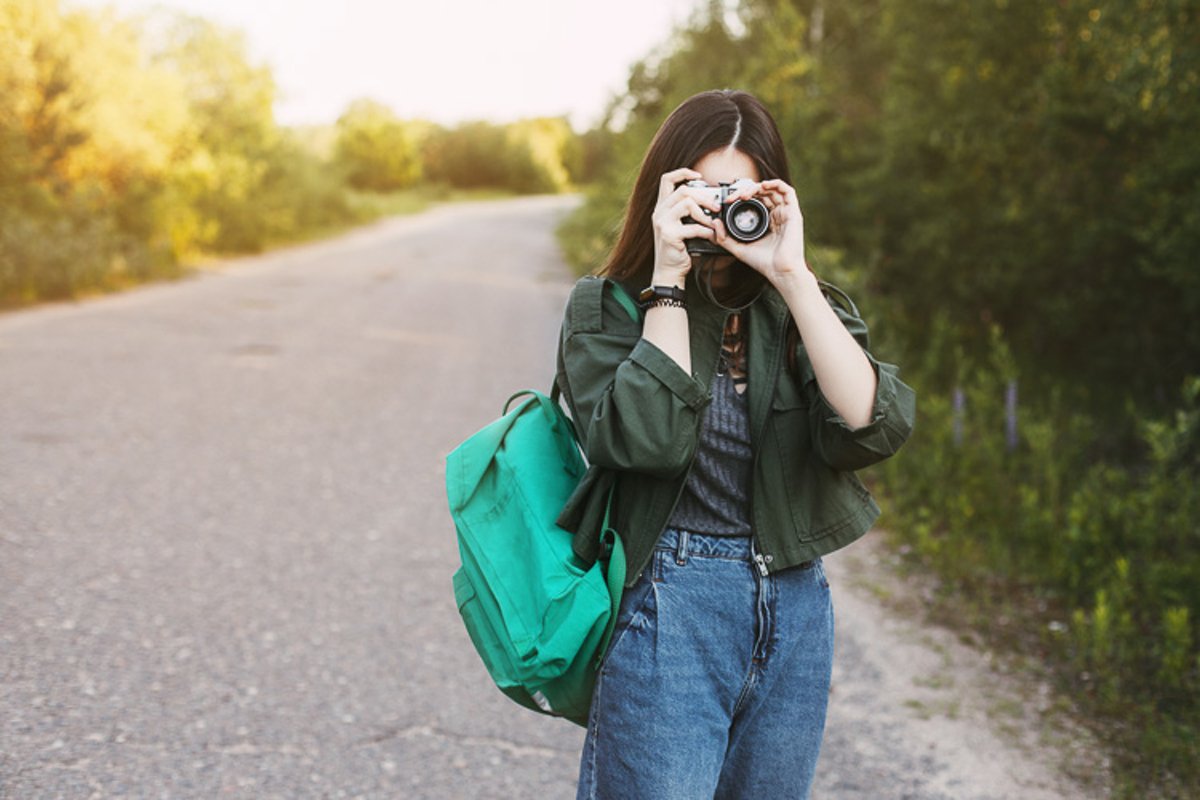 Cute brunette looks at the camera lens. example image 1