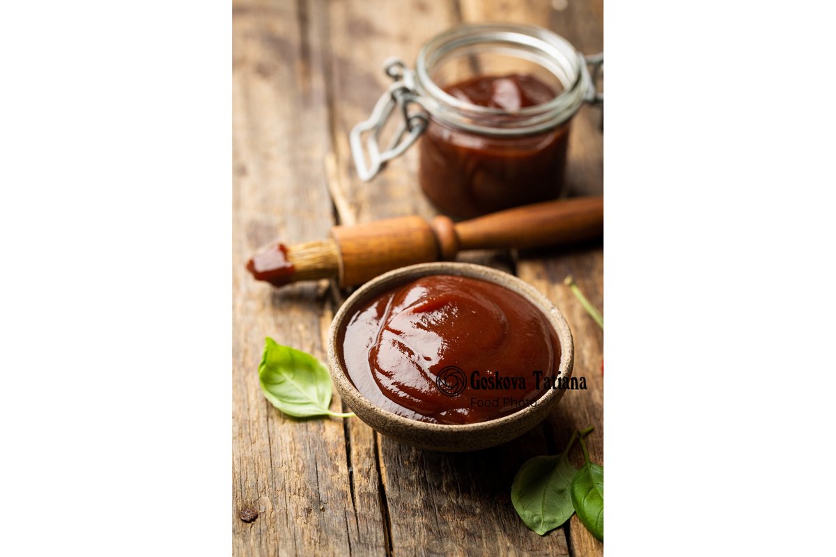 Photo of Barbecue sauce in a saucer with basting brush example image 1