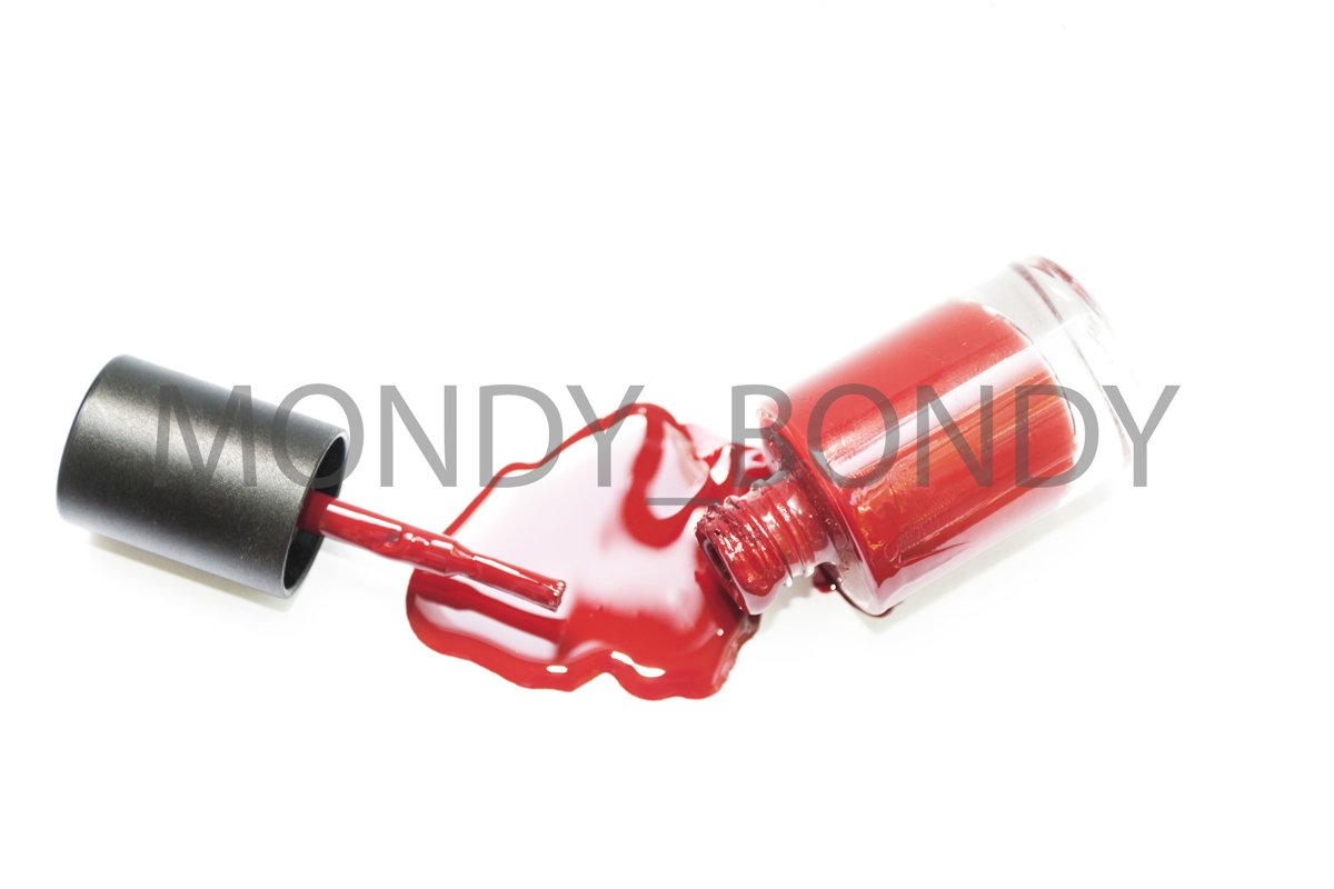 A bottled bottle of red nail polish. Drip varnish example image 1