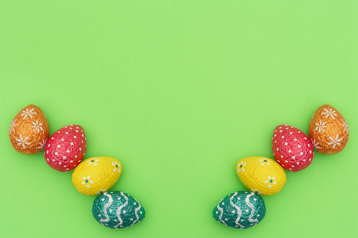 Colorful painted orange, blue, red and yellow Easter eggs example image 1