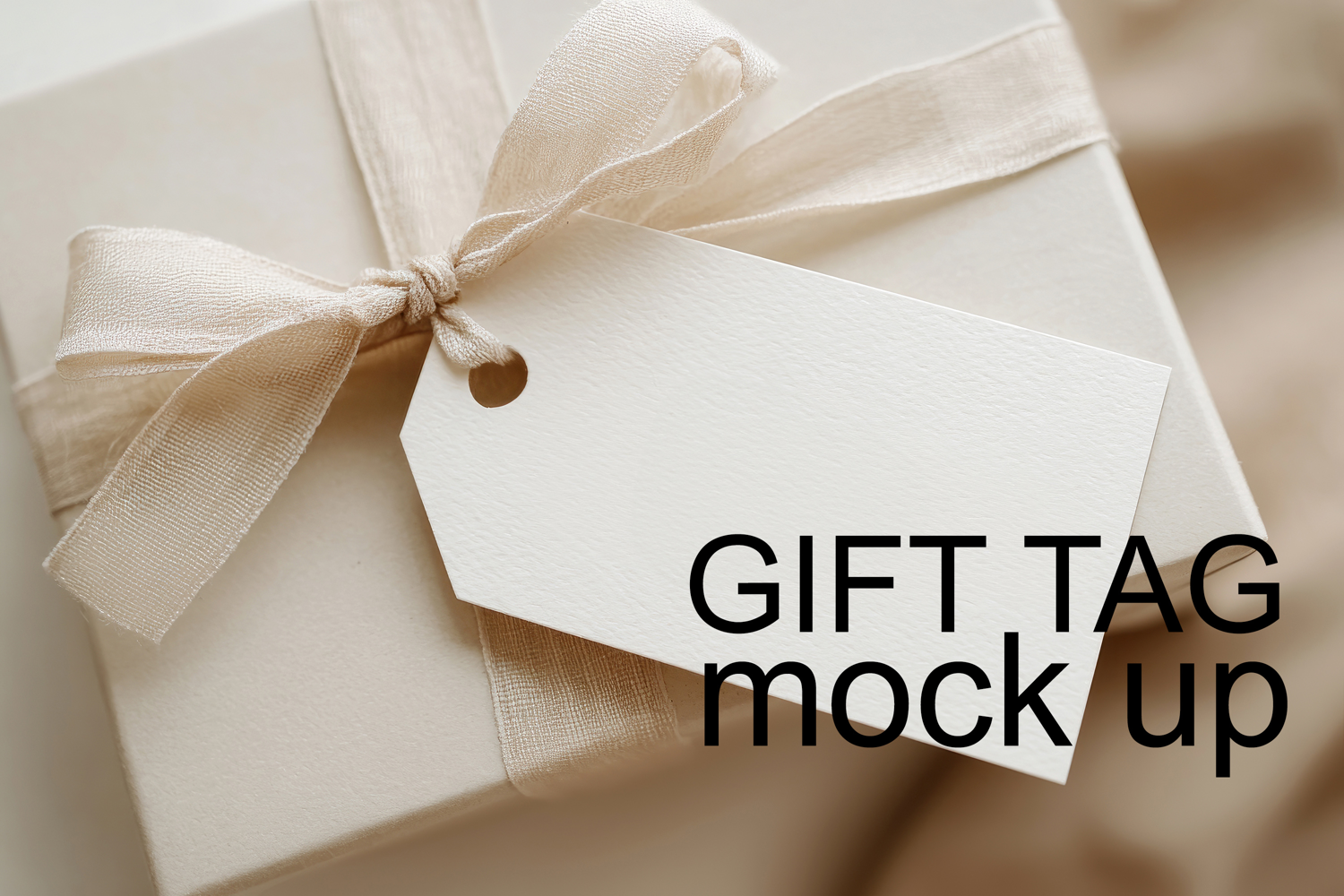 Elegant beige gift box with ribbon and blank tag mockup wedding birthday Christmas