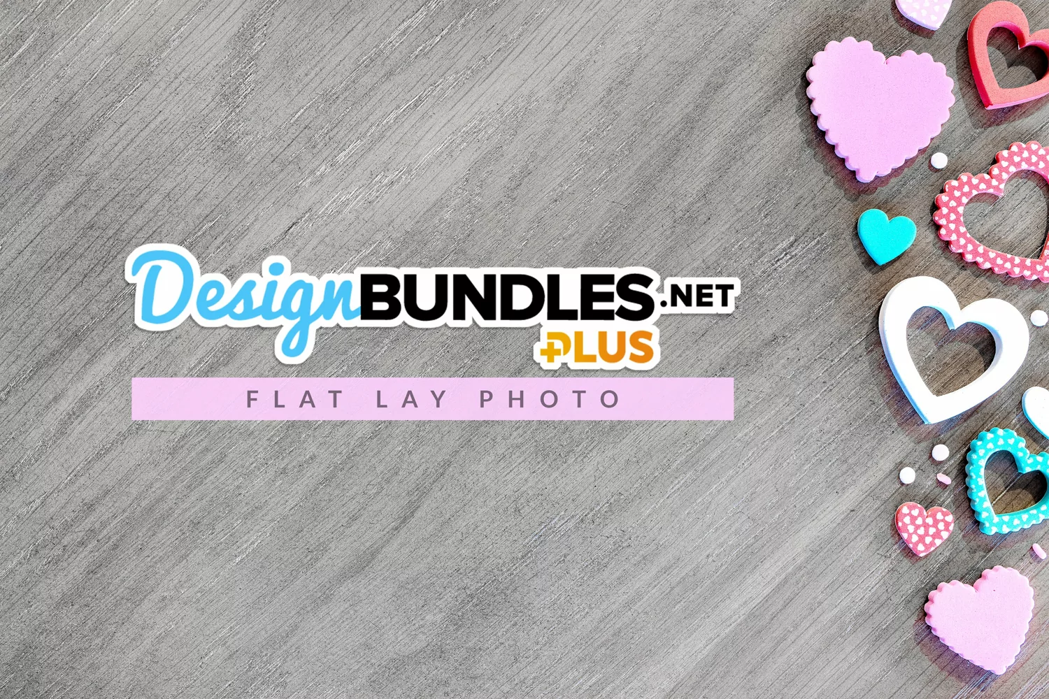flatlay image of colorful heart stickers on gray wood background