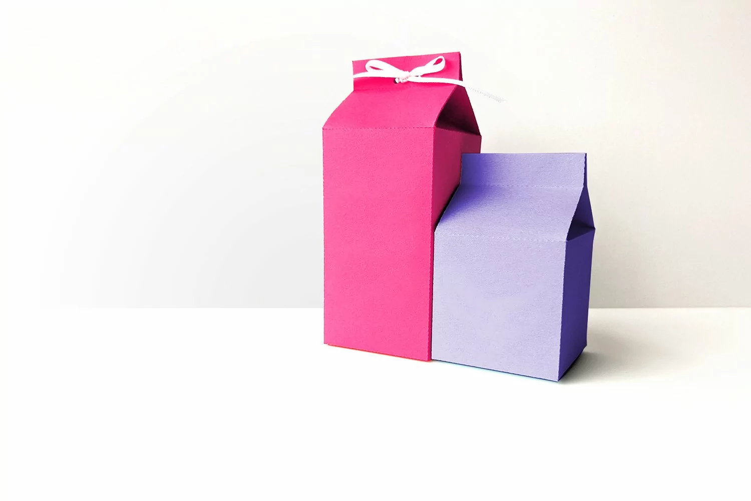 Milk carton shaped gift box SVG design in two sizes - half pint and pint style milk container.