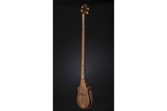Ancient Asian stringed musical instrument on black Product Image 1