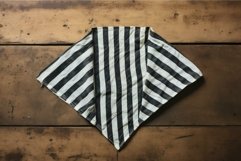 Striped kitchen towel on wooden table Product Image 1