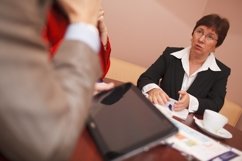Businesswoman explaining something in a meeting Product Image 1