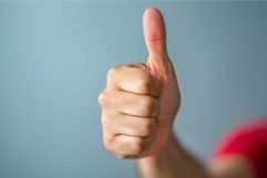 Man showing thumbs up gesture on blue background Product Image 1