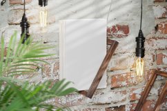Hardcover Books on a Holder on Brick Wall Mockup Product Image 2