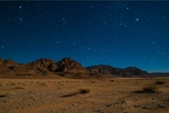 Starry night over desert landscape Product Image 1
