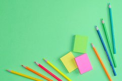 School and office supplies on office table, green background Product Image 1