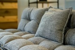 Cozy grey textured pillows on sofa Product Image 1