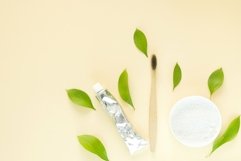Wooden toothbrush, eco toothpaste, tooth powder and leaves Product Image 1
