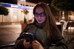 Young caucasian women in glass sitting in street cafe Product Image 1