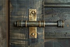 Close up of metal door latch securing a wooden door Product Image 1