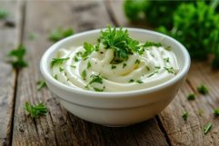 Fresh creamy mayonnaise with parsley garnish Product Image 1