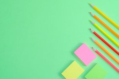 School and office supplies on office table, green background Product Image 1