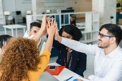 Close up palms of motivated business people making high five Product Image 1