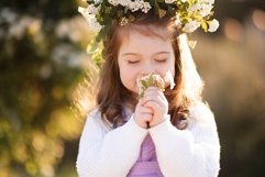 Cute baby girl with flowers outdoors Product Image 1