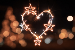 A heart-shaped string of lights with stars hangs in a dark Product Image 1