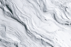 A close-up view of a white marble surface with gray veins Product Image 1