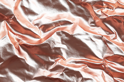 Crumpled metallic fabric with a shiny rose gold surface Product Image 1