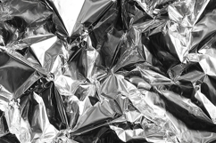 A cracked and wrinkled metallic surface texture Product Image 1