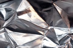 A crumpled silver foil with reflective surfaces Product Image 1
