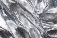 A shiny silver fabric with smooth folds and creases Product Image 1