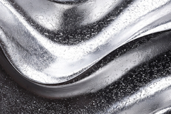 A shiny metallic surface with a wavy pattern Product Image 1