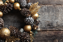 Gold and Black Pinecone Wreath on Rustic Wood Background Product Image 1