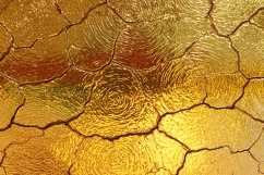 A cracked golden surface with a textured, spiral pattern Product Image 1