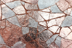 A cracked and weathered stone surface with a mosaic pattern Product Image 1