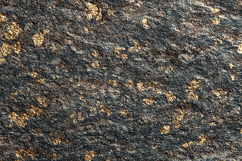 A rocky surface with gold specks scattere throughout Product Image 1