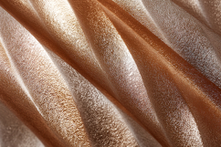 A luxurious rose gold fabric with soft folds Product Image 1