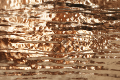 A rippling molten copper with a reflective surface Product Image 1