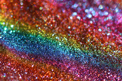 Rainbow-colored glitter background with sparkling particles Product Image 1