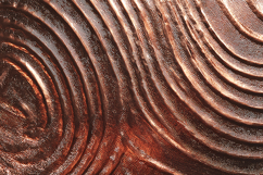 A copper surface with concentric circular patterns Product Image 1