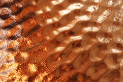 A shiny, metallic surface with a textured pattern Product Image 1