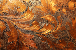 A intricate copper floral pattern on a textured surface Product Image 1