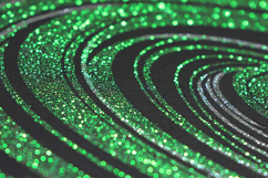 Green glittery spiral design on a black background Product Image 1