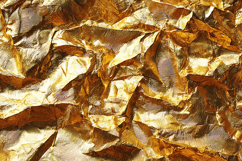 A crumpled gold foil with a textured surface Product Image 1