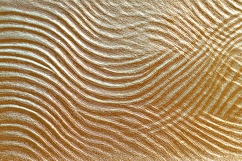 A gold surface with wavy lines Product Image 1