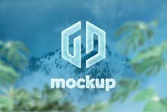 Frozen Logo Mockup behind the green leaves Product Image 1