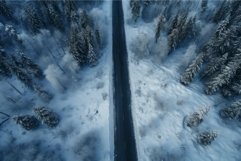 Aerial winter road through snowy forest Product Image 1