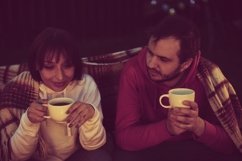 Happy Man And Beautiful Woman Hugging Resting Near Bonfire Product Image 1