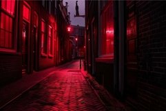 Narrow street illuminated by red lights at night Product Image 1