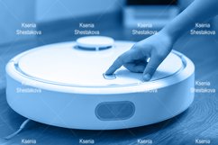 kids hand press button to turn the robot vacuum cleaner on Product Image 1